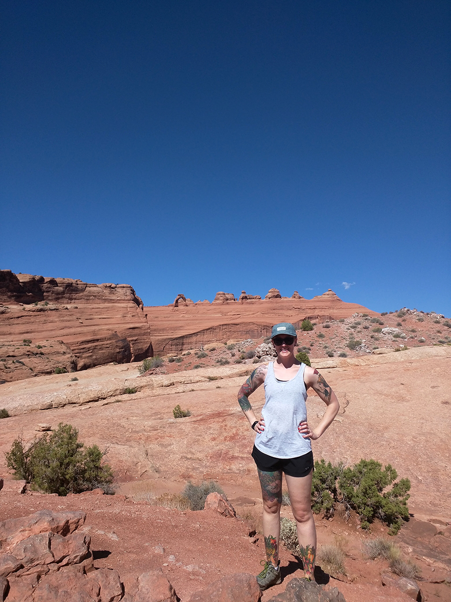 Heather at Arches National Park in front of Delicate Arch