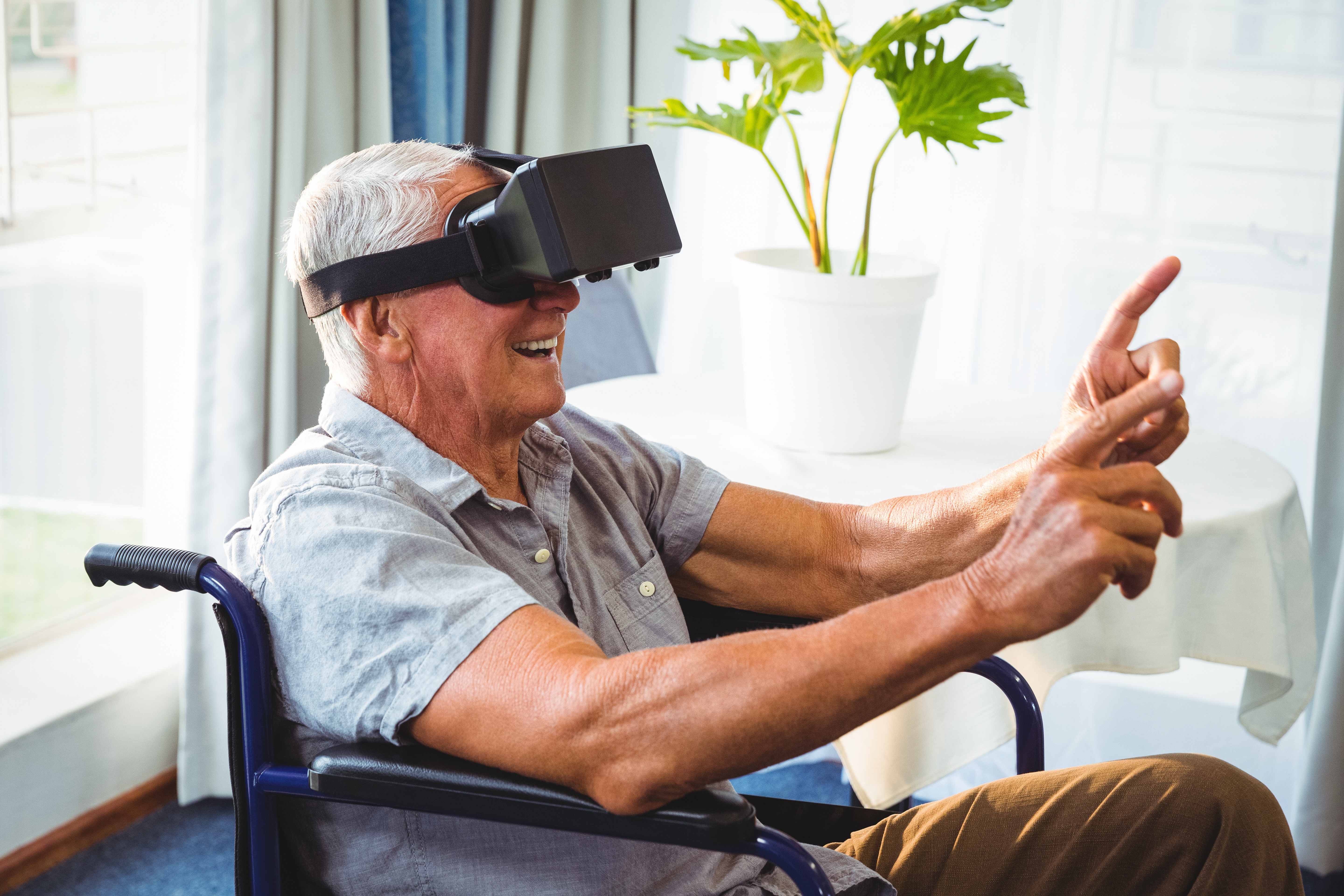Senior Man with Mobility Issues Using VR for Travel
