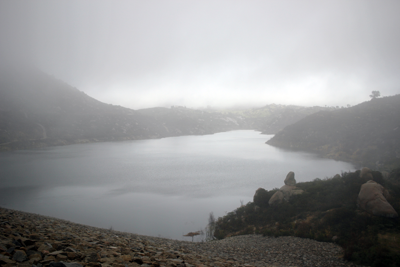 The misty, rainy view at the top of Ramona Dam on the Blue Sky Reserve hike
