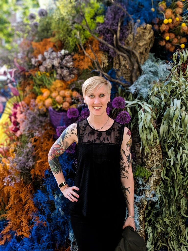 Heather Physioc in front of Flower Display at Duke of York Square in London, UK