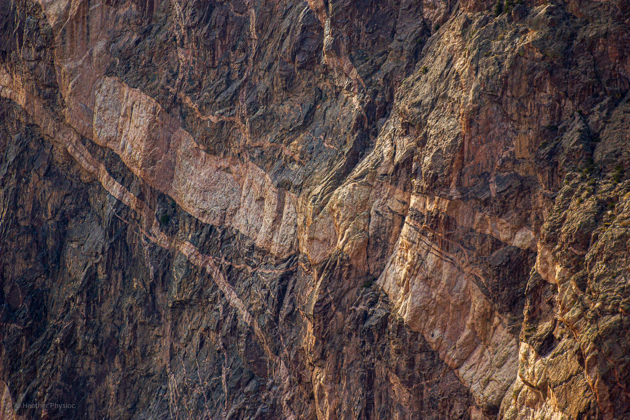 Pegmatite streaks in canyon walls at Black Canyon of the Gunniso