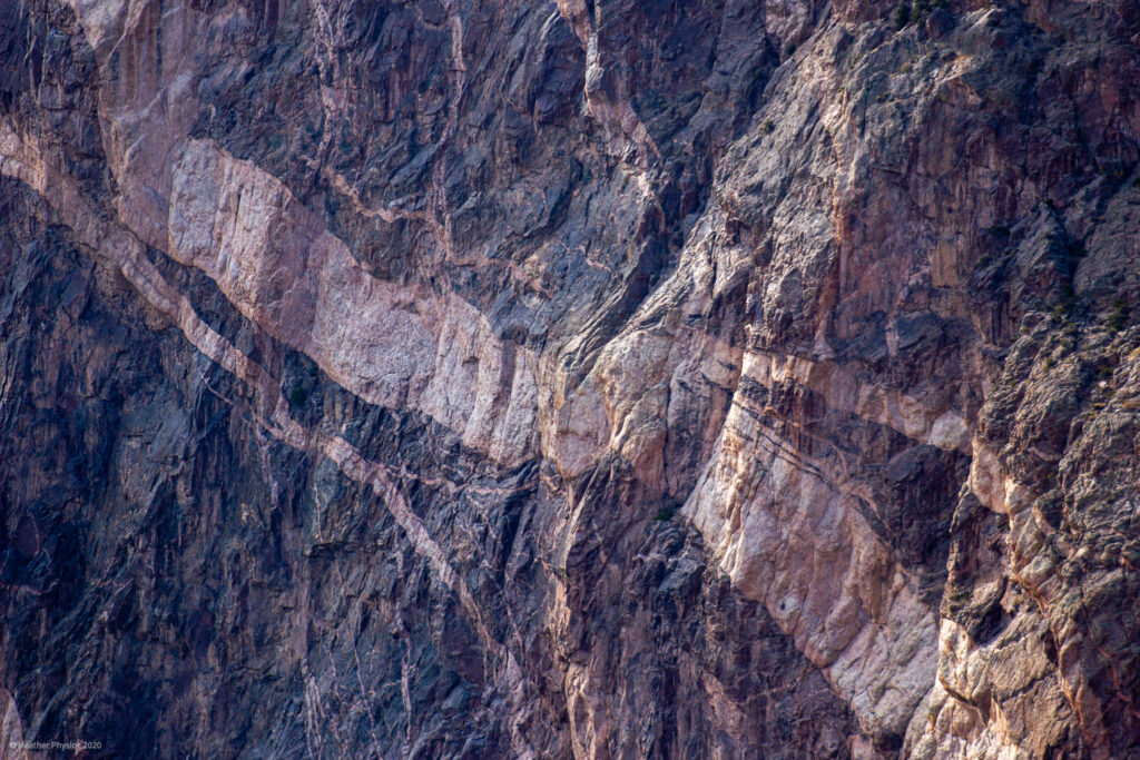 Pink Streaks of Pegmatite through Dark Granite at Black Canyon of the Gunnison National Park - Canyon Walls