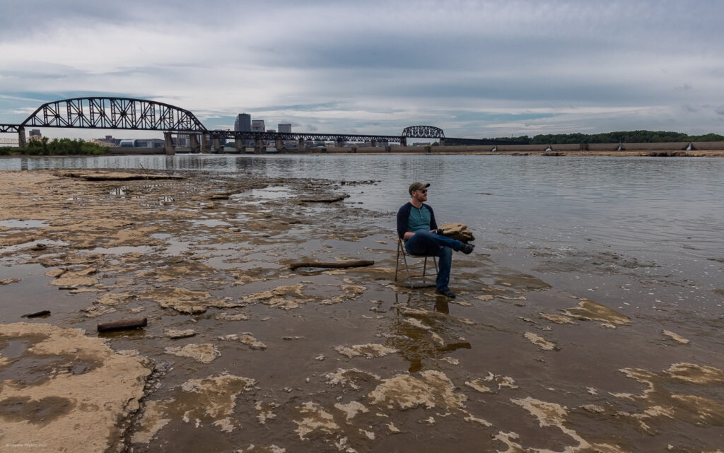 Cody Sitting in Chair in Fossil Beds at Falls of the Ohio State Park in Indiana