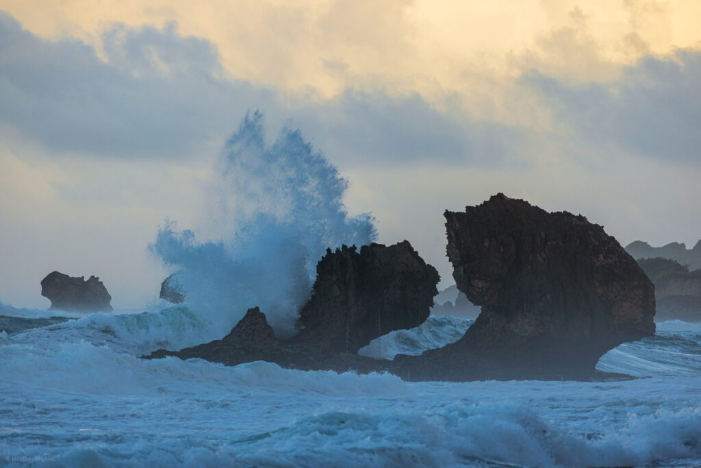 Waves crashing on coral boulders with an impending storm at Bathsheba Beach in Barbados - photo by Heather Physioc