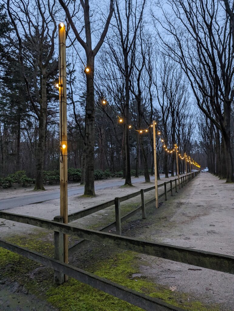 String lights along a fence at the entryway to EuroParcs De Zandig near Otterlo in the Netherlands